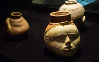 A piece of pottery shaped like a human head