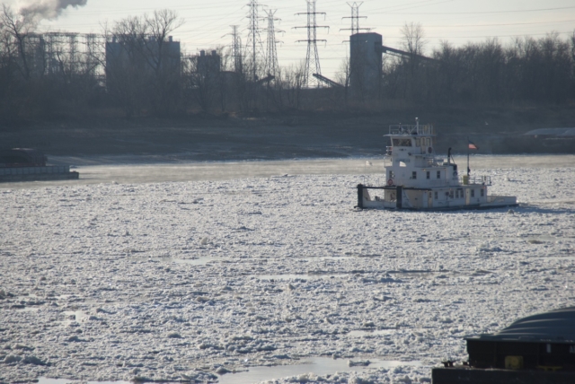 A tow pushes through ice on the Mississippi River at downtown St. Louis